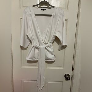 Express Women’s Off White Wrap Blouse in a size L.